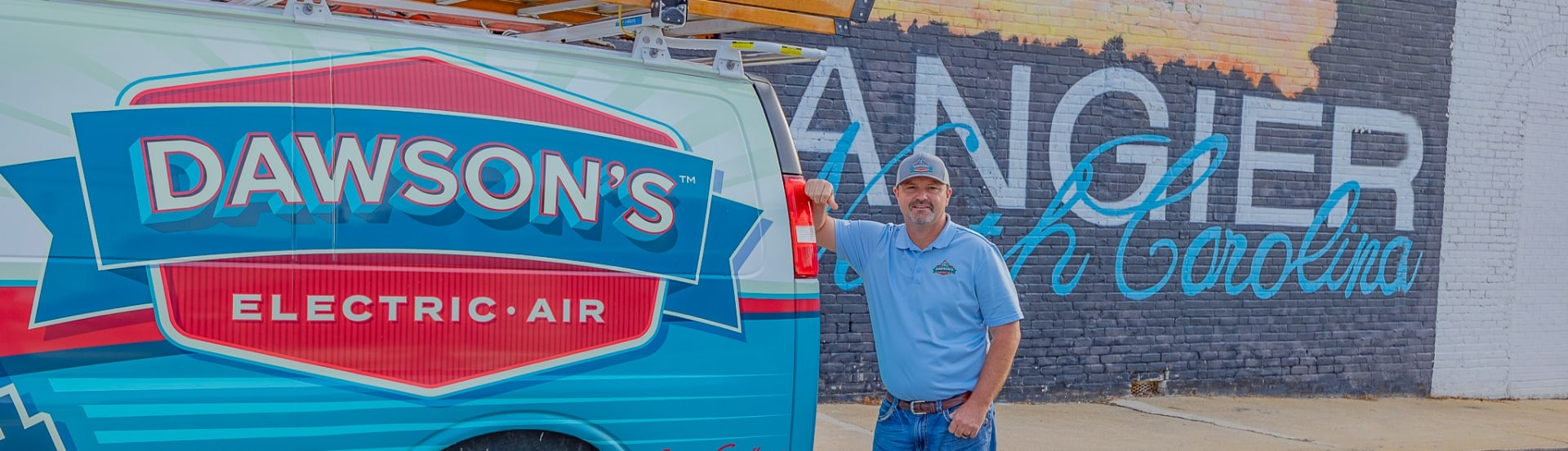 Dawsons Owner Travis With Angier Mural