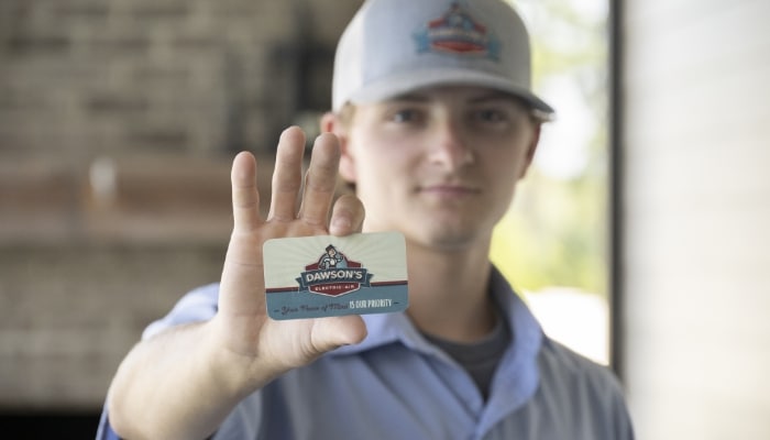 Technician Holding Buisness Card