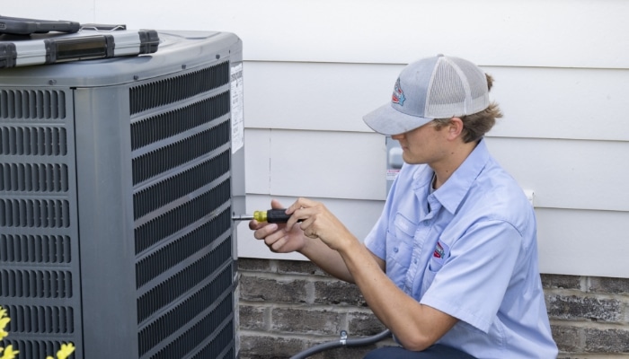 Technician Working On Hvac Unit